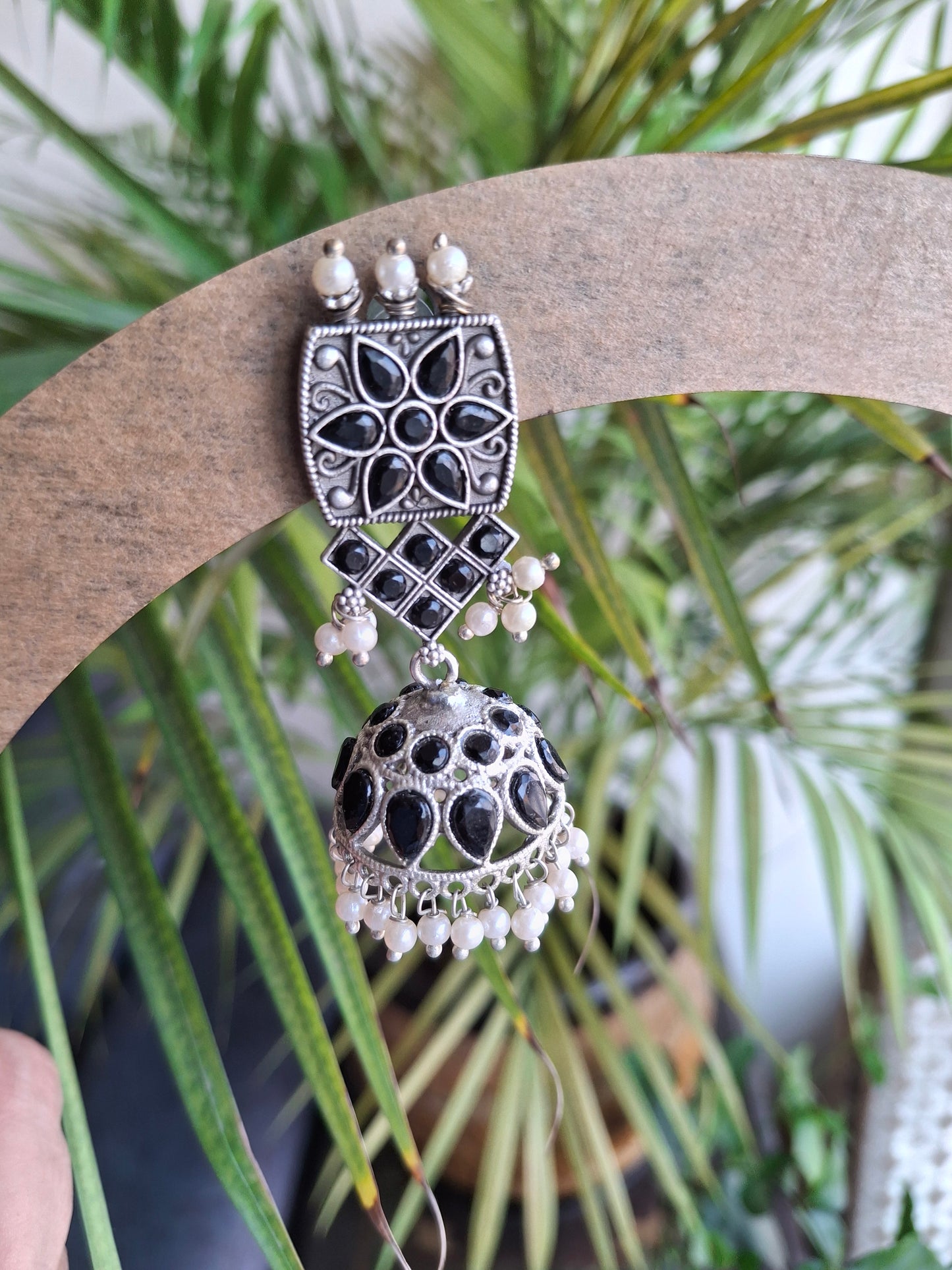 BLACK MAHIRA SILVER POLISHED JHUMKI